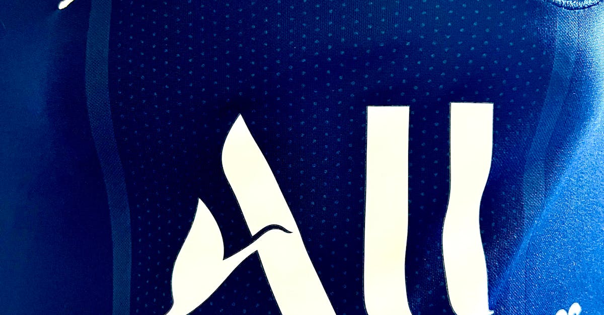 Detailed view of Paris Saint-Germain jersey with sponsor logos and design elements.