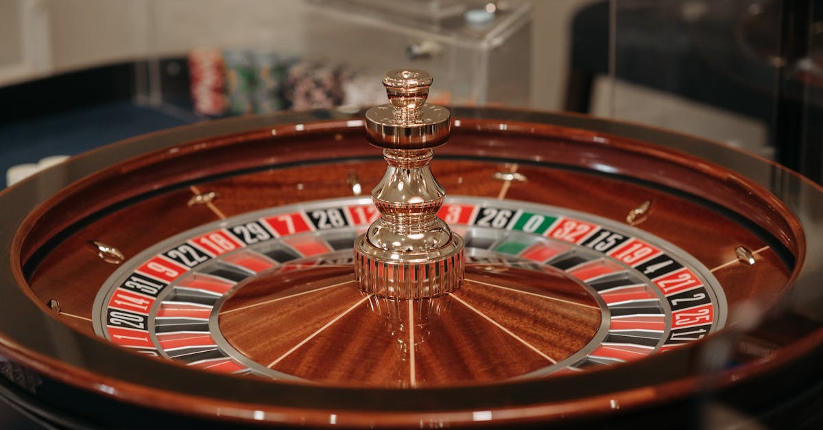 Close-up of a classic roulette wheel in a casino setting showcasing the elegant wooden design.